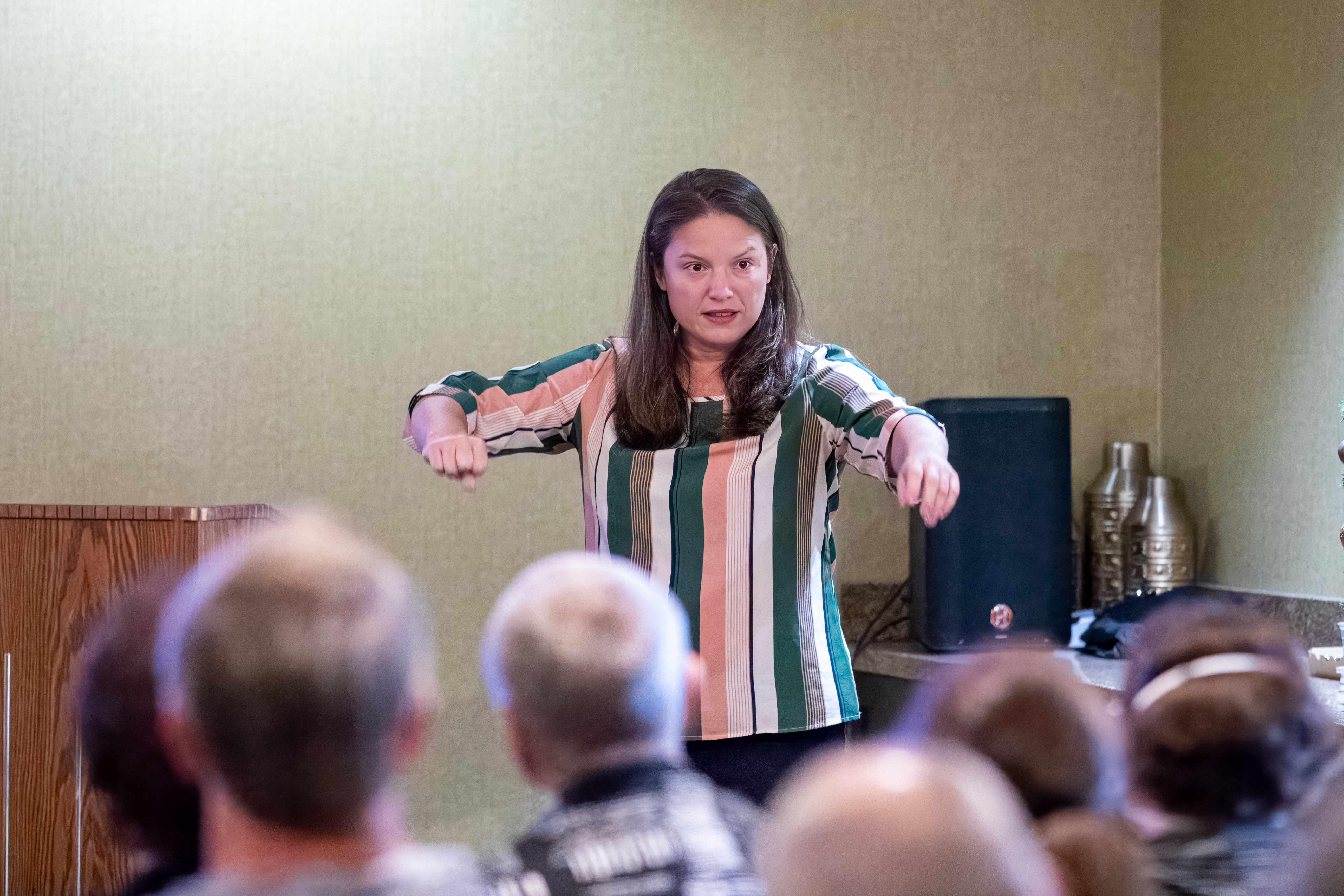 Rayna Reyes speaking at a federal benefits workshop